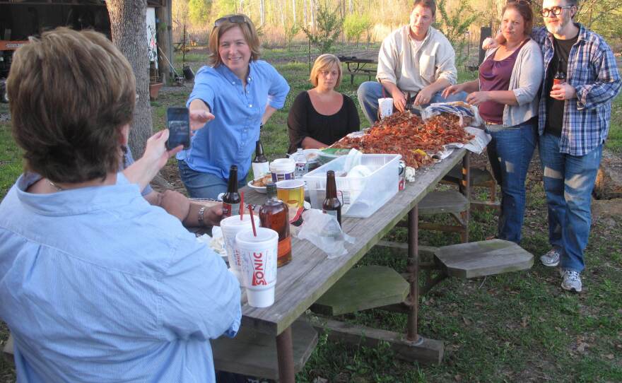 Ruthie Leming's friends and Rod Dreher (right) gather for a crawfish boil at Ronnie Morgan's camp by the Starhill Riviera. "When I'm gone," Morgan says, "the only thing that's going to show up to say I was here is the people I left behind."