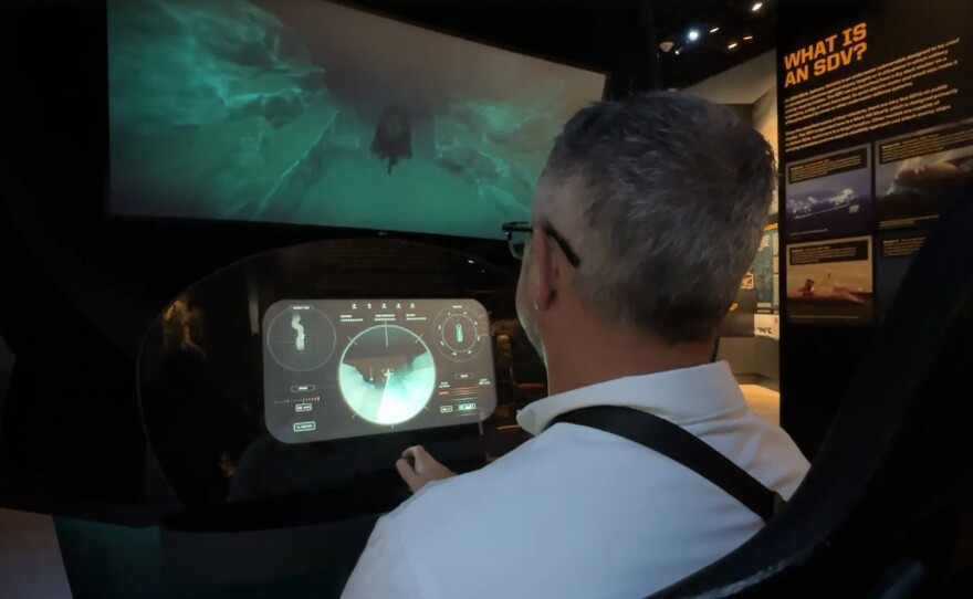 An individual interacts with part of an exhibit at the Navy SEAL Museum, Sept. 29, 2025.