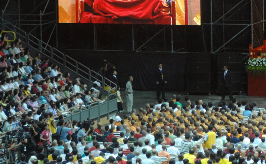 Tibet's spiritual leader, the Dalai Lama, led thousands in prayer at a ceremony to comfort victims of Typhoon Morakot in Kaohsiung, Taiwan, on Sept. 1. China signalled its disapproval by postponing or scaling back planned events with Taiwan.