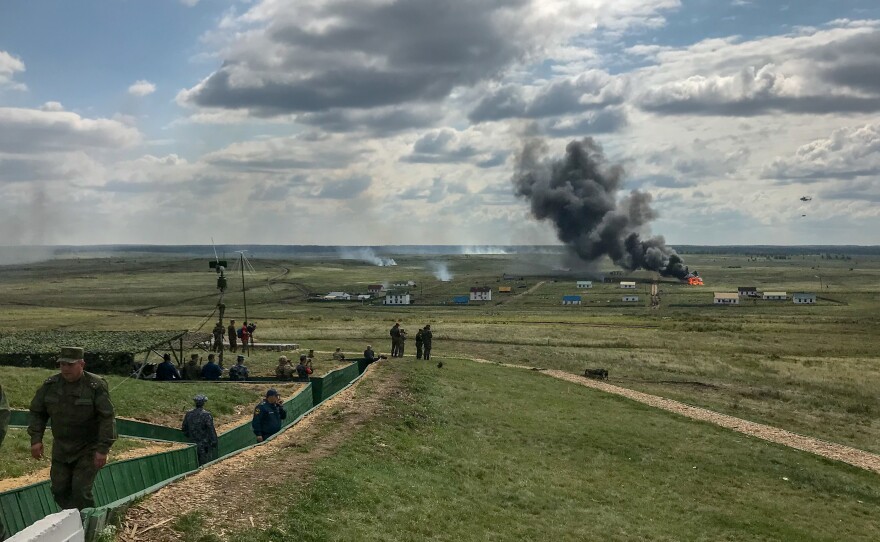 Aircraft and ground troops from seven countries, including China and Russia, go through an "anti-terrorist" exercise at the Chebarkul tank range in Russia on Aug. 29.