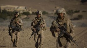U.S. Marines from Fox Company 2nd Battalion 3rd Marines patrol on the outskirts of their forward operating base, in Farah Province, southern Afghanistan, on September 28, 2009.