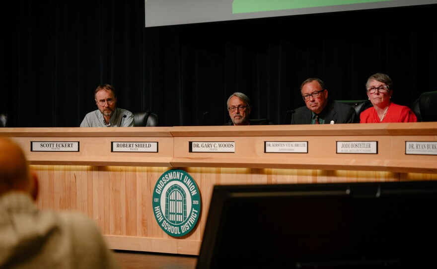 From left, Grossmont Union High School District governing board trustees Scott Eckert, Robert Shield and Gary Woods, and Superintendent Kirsten Brulte, listen to a speaker discuss the Christian nationalist activist Charlie Kirk during a meeting at Grossmont High School in El Cajon, California on Oct. 9, 2025.