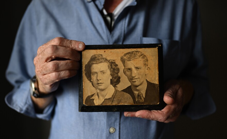 Paul Crawford holds a photograph of his mother and father at his home in Glenavy. His father John Crawford was shot dead in 1974 in front of the West Belfast furniture factory he ran.