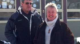 Terry Tatro and Irene Clarke stand in front of the People's United Bank branch on Main Street in Alburgh, Vt. The two feared that the bank's closing would leave a gaping hole in their community.