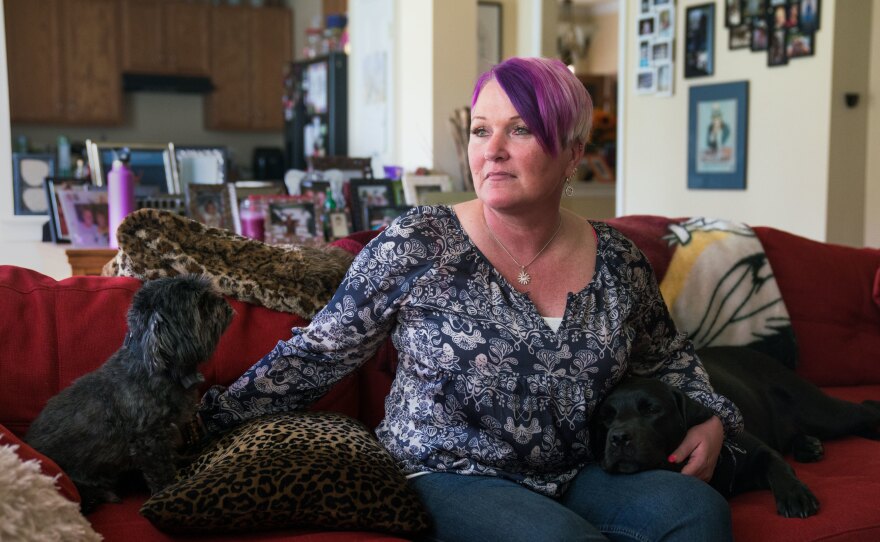 Michel, joined on the couch by longtime pet Blade and service dog Lizzy, says at least three male service members assaulted or molested her between 1990 and 2005.