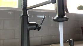 Water comes out of a kitchen faucet, June 12, 2021.