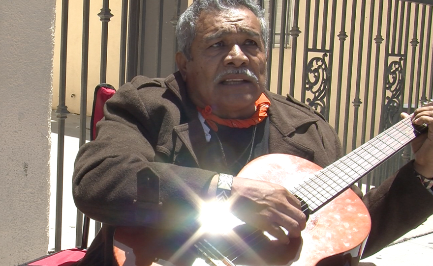 Felix Gartia sings corridos outside of Mexican consulate on hunger strike, June 1, 2015.