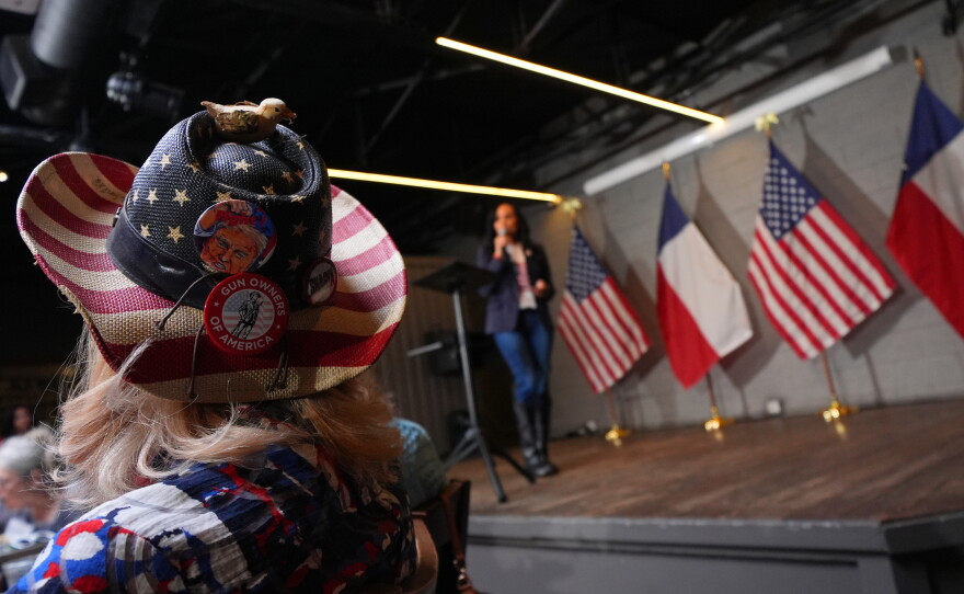 The hat of Diane Benjamin, Dallas #2021 precinct chair, is visible at a campaign event for Texas Attorney General Ken Paxton on May 18, 2026, in Dallas.