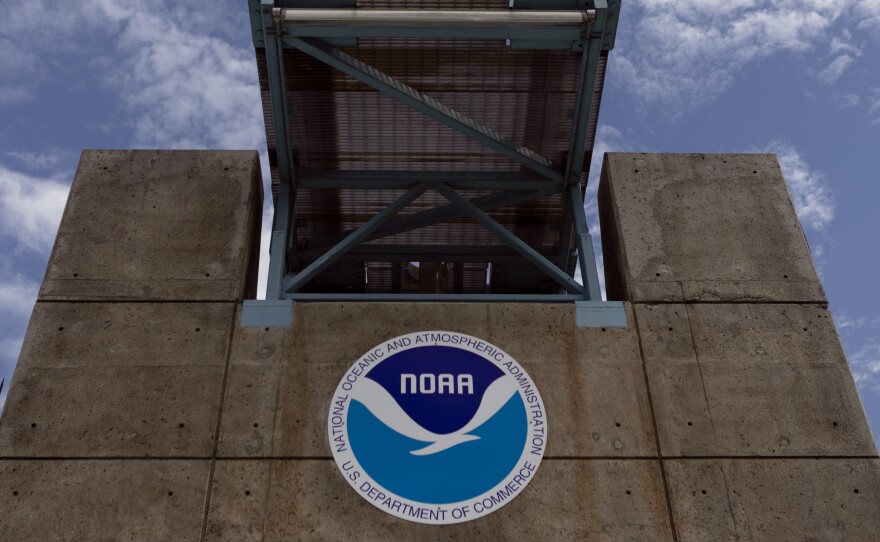 The logo of National Oceanic and Atmospheric Administration is seen at the Nation Hurricane Center in  Miami on on August 29, 2019. President Biden has nominated Rick Spinrad to head NOAA.