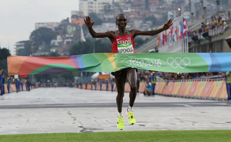 Kenya's Eliud Kipchoge crosses the finish line to win the men's marathon in Rio on Sunday. He won by more than a full minute.