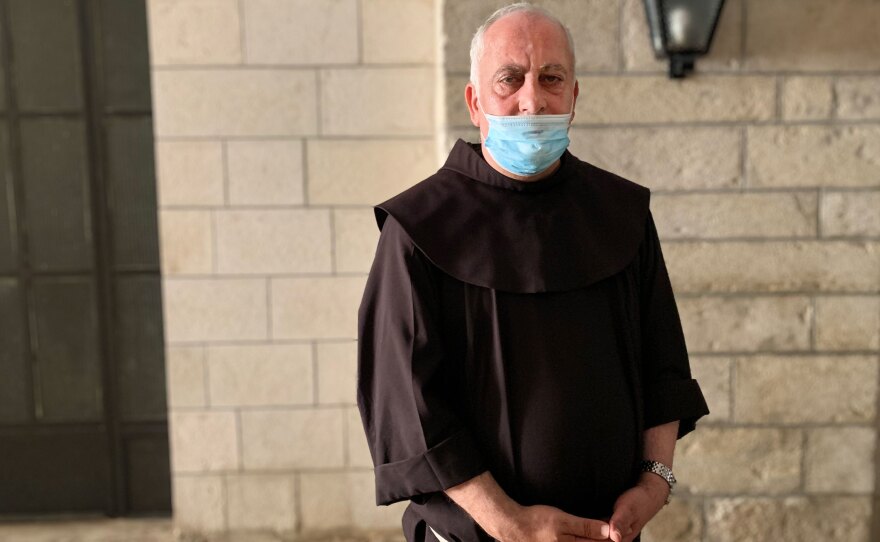 For months, Father Amjad Sabbara held a series of mini-Masses so everyone in his community could attend a socially distanced Mass at least once a month. But a second wave of infections afflicting Jerusalem's Palestinian neighborhood changed that.