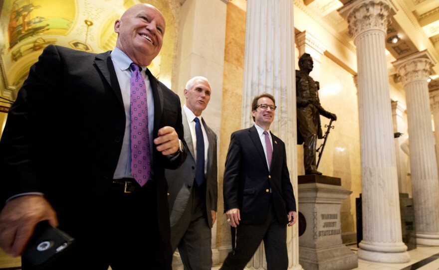 Rep. Kevin Brady, R-Texas (from left), with Vice President Pence and and Rep. Peter Roskam, R-Ill., on Capitol Hill, noted that the CBO analysis confirms that the House GOP health care bill will cut the deficit.