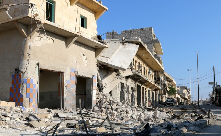 Buildings and debris in Aleppo's Darat Izza district, in Syria, on Sunday.