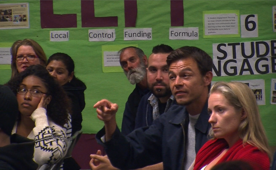 Josh Funn, an activist who was active in critiquing the San Diego Police Department's handling of the Occupy movement, pointed to officers he said are abusive at the March 26, 2014 town hall meeting at Cherokee Point Elementary School.
