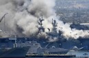 Smoke rises from the USS Bonhomme Richard after an explosion and fire on board the amphibious assault ship at Naval Base San Diego. The Navy is investigating whether the fire was due to arson.