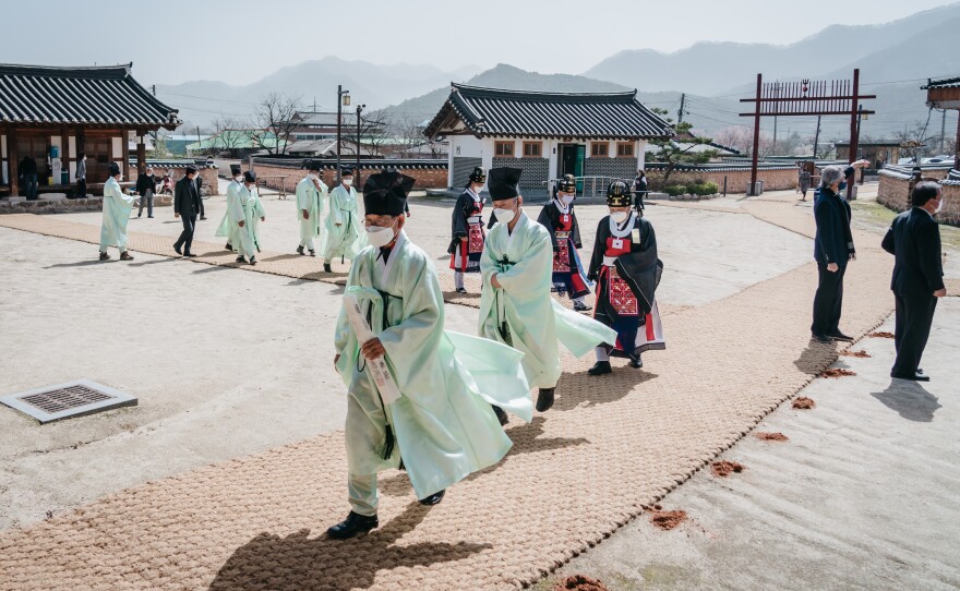 Men enter Museong Seowon, a Confucian academy in Jeongeup, South Korea, to participate in the spring ceremony in April.