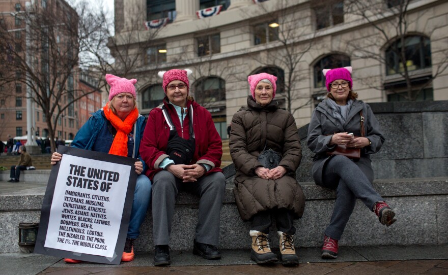 (Left to right) Melissa Breen, Laura Jamison, Sandy Cuza and Kathryn Wehrmann chat while sporting matching pink hats in support of the march.