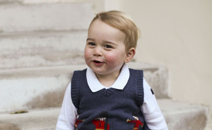 Official Christmas photo of Prince George, 1, taken in late November in a courtyard at Kensington Palace in London.