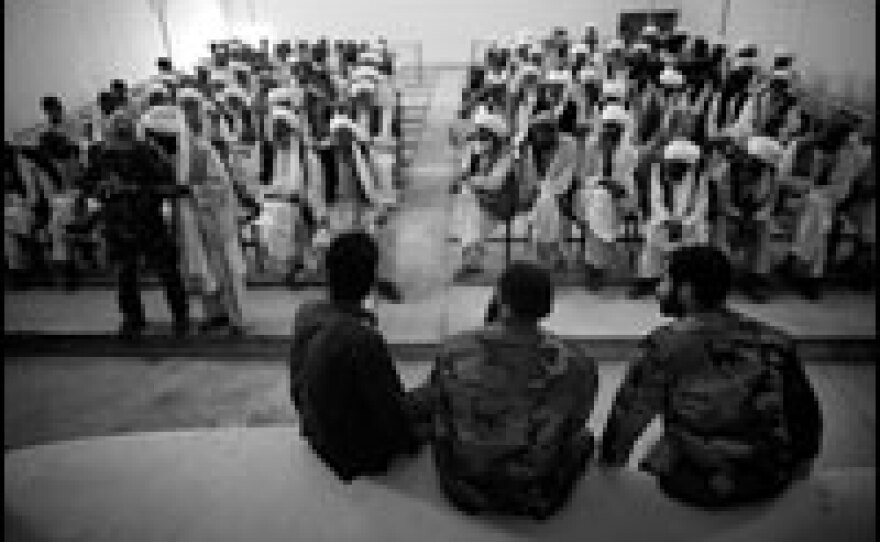 U.S. Special Forces soldiers listen to tribal elders from Herat province who have gathered for a <em>shura,</em> or meeting, near the U.S. Army's Firebase Thomas in western Afghanistan. The American government has described the current situation in Afghanistan as a "lack of governance."