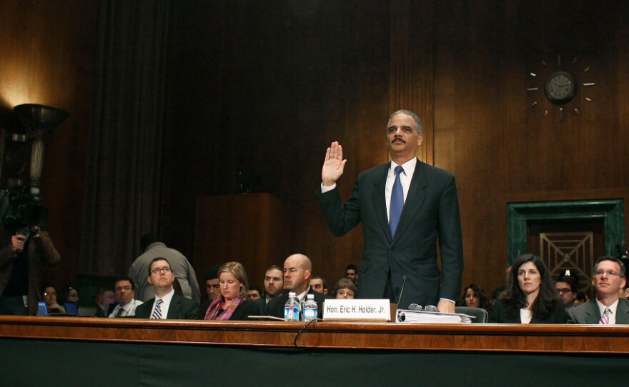 U.S. Attorney General Eric Holder is sworn in before testifying during a Senate Judiciary Committee hearing about the controversial "Fast and Furious" gun-trafficking program on Tuesday.