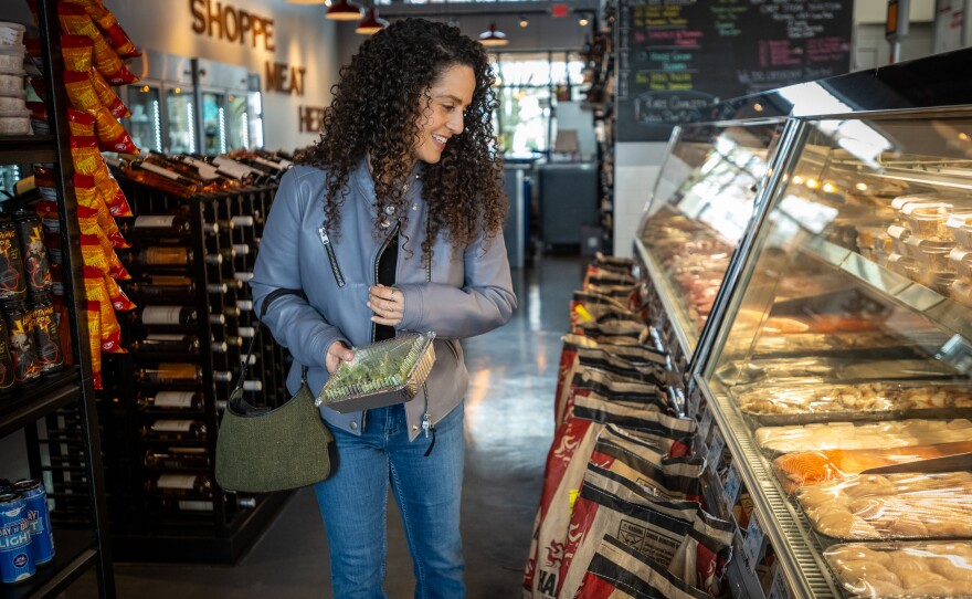 Karen Seagraves browses the selections at The New York Butcher and Wine Shoppe in Charlotte, N.C.