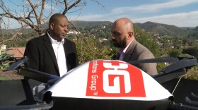 USOG founder and CEO Pharns Genece, left, talks with SortPak CEO Raymond Shirvanyan, Jan. 15, 2020.