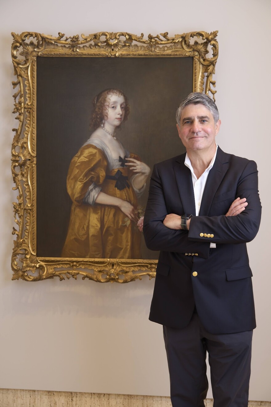 Derrick Cartwright, the Timken Museum's director of curatorial affairs and a professor of art history at the University of San Diego, stands next to an Anthony van Dyck painting at the Timken in an undated photo.                                