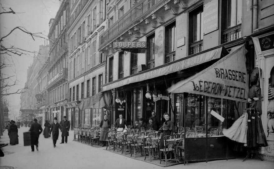 People gather outside Brasserie Légeron-Vetzel in Paris circa 1900.