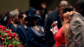 Lesley McSpadden is comforted during the funeral services for her son Michael Brown inside Friendly Temple Missionary Baptist Church in St. Louis Missouri on Monday.
