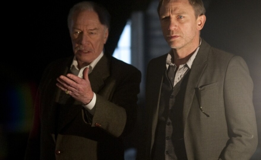 Henrik Vanger (Christopher Plummer, left) offers Mikael Blomkvist (Daniel Craig) a big paycheck to crack the mystery of his missing granddaughter.