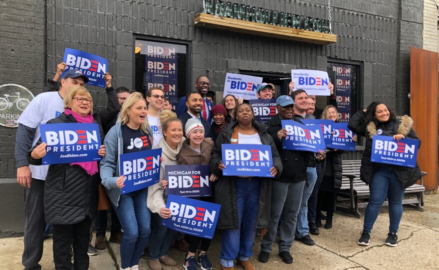 Michigan Lt. Gov. Garlin Gilchrist, at center back in red tie, has endorsed Joe Biden and recently helped celebrate the opening of a field office in Detroit's Arden Park neighborhood.