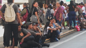 People gather outside shopping mall after an earthquake hit Panama City, Friday, Oct. 9, 2026.
