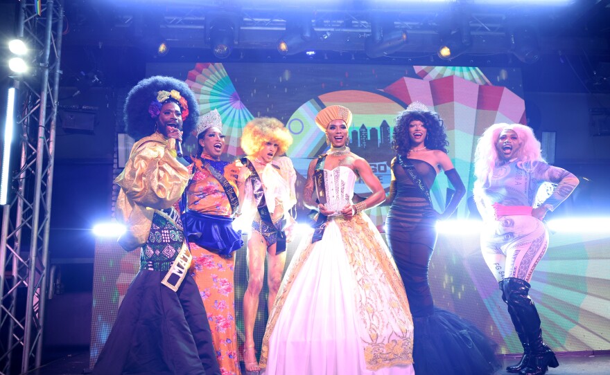 Various drag queens and entertainers stand onstage with host Amber St. James (left) at the 2024 San Diego Black Pride festival in this undated photo.