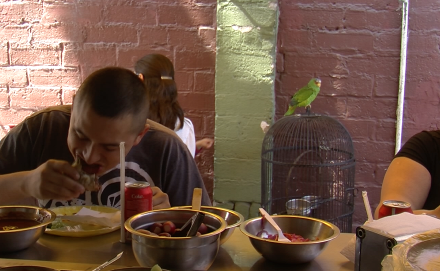 Clients eat tacos at Tacos Memo's, also known as Parrot Tacos, June 3, 2015.