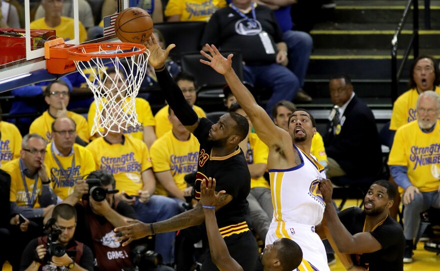 LeBron James of the Cleveland Cavaliers goes up for a shot Monday night in front of James Michael McAdoo of the Golden State Warriors in the first half in Game 5 of the 2016 NBA Finals in Oakland, Calif.