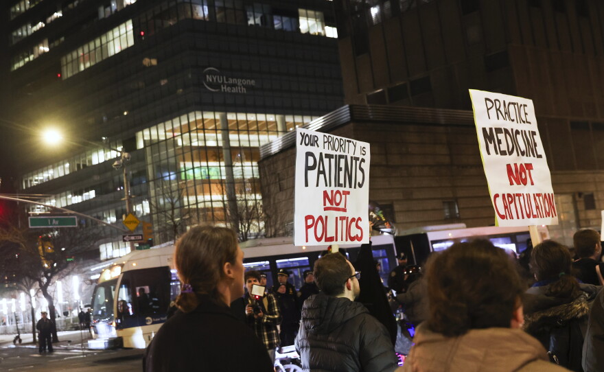 People in favor of healthcare for transgender youth march outside NYU Langone hospital in New York City in February 2025.