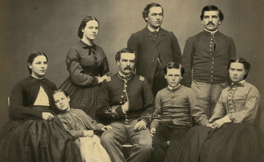 Horace Wilson and other members of his family in a portrait believed to date to the late 1850s or early 1860s. He's the mustachioed fellow standing in the back right.