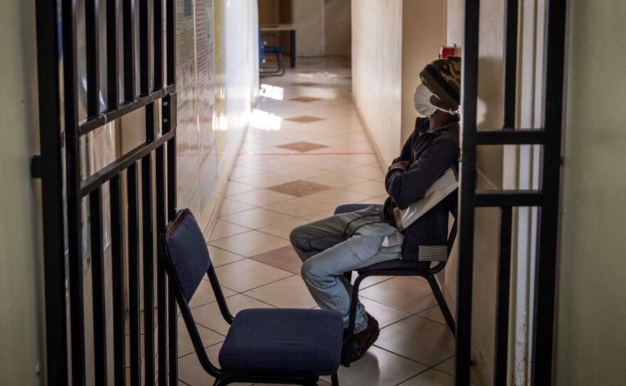 A South African patient with drug-resistant tuberculosis waits to be seen by a doctor at a Johannesburg hospital.