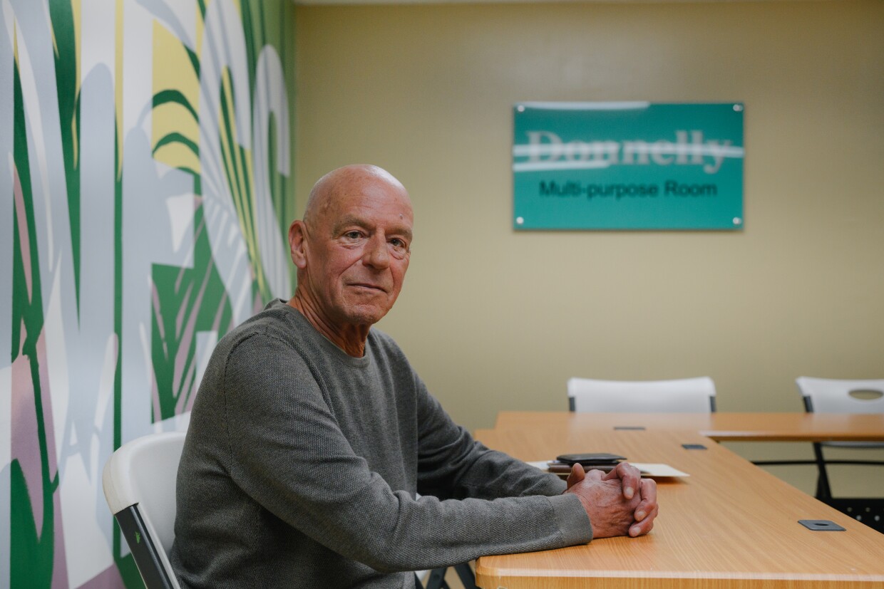 Donal Donnelly, a retired superior court judge and longtime financial supporter of the Imperial Valley LGBT Resource Center, sits for a portrait at the center in El Centro, California on February 7, 2025.