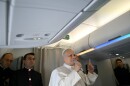 Pope Leo XIV speaks to journalists aboard his flight bound for Algiers' Houari Boumédiène International Airport on Monday, April 13, 2026, at the start of an 11-day apostolic journey to Africa.