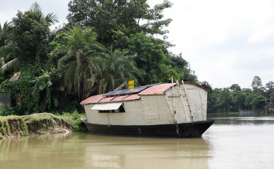 The charity has a fleet of 23 school boats. They pick up kids along the river, then pull over into the marshy riverbank to hold class.