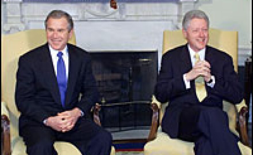 <strong>Another Clinton-Bush handoff:</strong> President Bill Clinton meets with President-elect George W. Bush at the White House for discussions on the transition of power, Dec. 19, 2000.