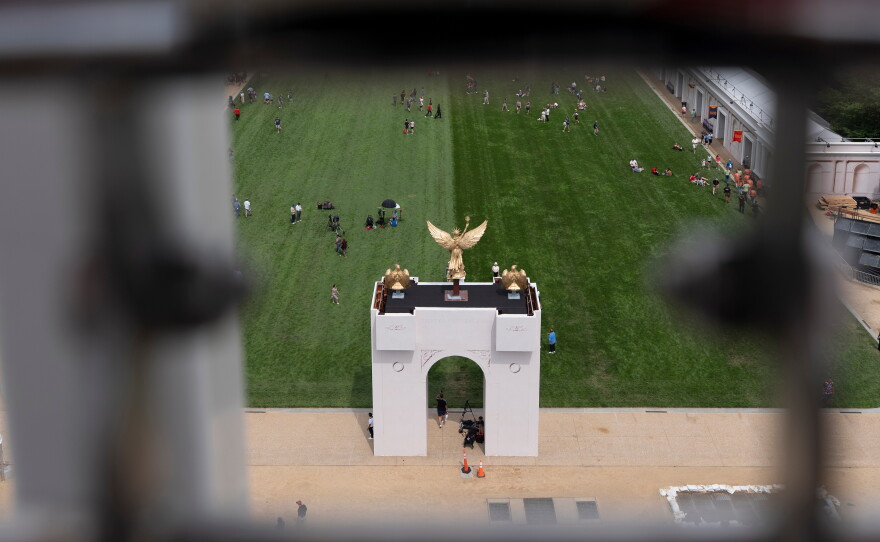 A mock-up of President Trump's proposed triumphal arch, pictured during the state fair on D.C.'s National Mall in June. The real thing needs to undergo a historic preservation review before it can be approved.