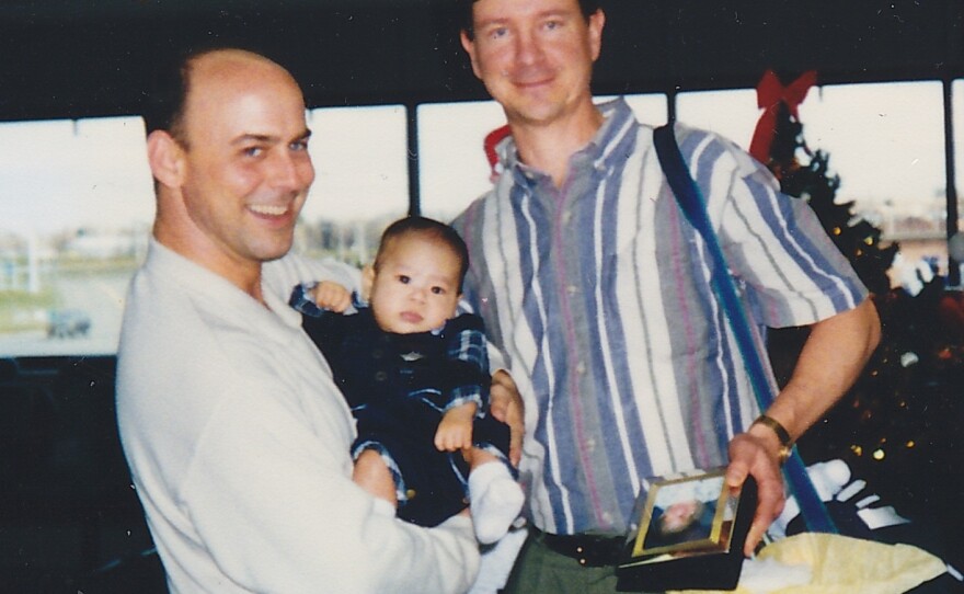 Curtis and David Wikeira arrive home from Vietnam with John in 1998.