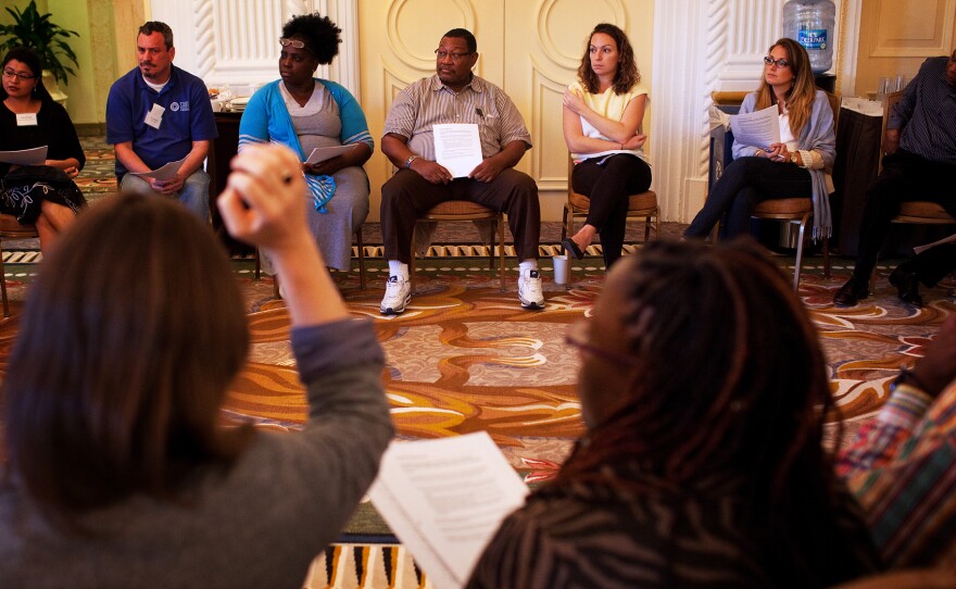 Assisters get up to speed on how best to explain the new health coverage choices during training on Sept. 25 at the Omni Shoreham Hotel in Washington, D.C.