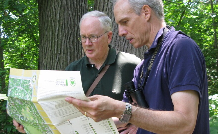 Edward Barnard (left) and Ken Chaya look at their map of Central Park as they stand in its North Woods.