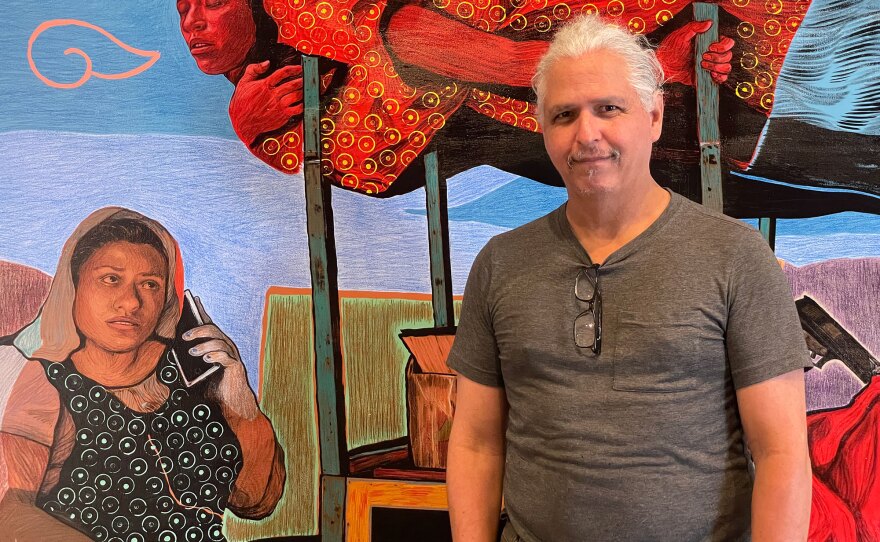 Artist Hugo Crosthwaite stands in front of his painting "Annunciation" during installation at Bread and Salt on Aug. 2, 2024.