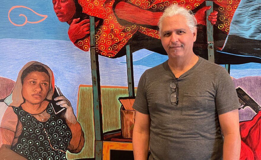 Artist Hugo Crosthwaite stands in front of his painting "Annunciation" during installation at Bread and Salt on Aug. 2, 2024. 