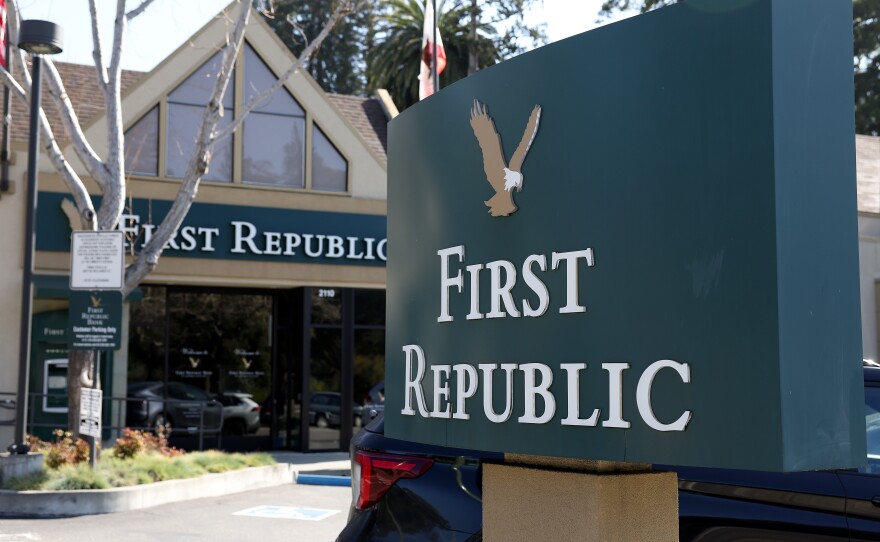 The First Republic Bank sign is shown in Oakland, Calif., in front of one of the lender's offices on March 16, 2023. First Republic shares continued to fall on Monday amid concerns about its financial health.