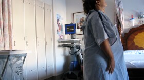 A woman tries to tough out her labor pains before having a baby at UCSD Birth Center.